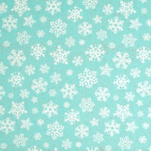 Tela patchwork cristales de nieve sobre turquesa